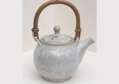 White tea pot with cane handle